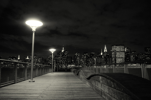 Gantry Plaza State Park is a state park on the East River in the Hunter's Point section of Long Island City, Queens New York. It boasts spectacular views of the midtown Manhattan skyline, including the Empire State Building and the United Nations. Enjoy a relaxing stroll along the park's four piers or through the park's manicured gardens and unique mist fountain. Along the way take a moment to admire the rugged beauty of the park's centerpieces - restored gantries. These industrial monuments were once used to load and unload rail car floats and barges; today they are striking reminders of our waterfront's past. With the city skyline as a backdrop and the gantries as a stage, the park's plaza is a wonderful place to enjoy a spring or summer concert.