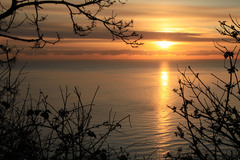 The sun rising over the Irish Sea and Killiney, Bay, Dublin, Ireland, Feb. 2012.