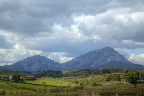 A view of Errigal and Mackoght mountain, part of the Derryveagh Mountains. 

Errigal is the tallest peak in County Donegal, and the 76th tallest peak in Ireland.

Mackoght is the 351st tallest peak in Ireland