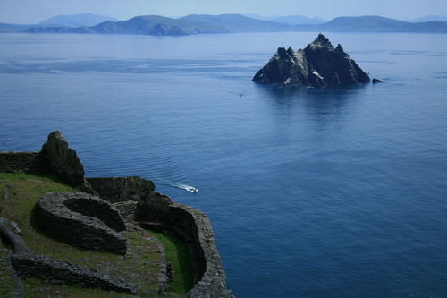 Skellig Michael, or Great Skellig, is an island (the larger of the two Skellig Islands) in the Atlantic Ocean, 11.6km west of the Iveragh Peninsula in County Kerry, Ireland. A Christian monastery was founded on the island at some point between the 6th and 8th century, and was continuously occupied until its abandonment in the late 12th century. The remains of this monastery, along with most of the island itself, were inscribed on the UNESCO World Heritage List in 1996