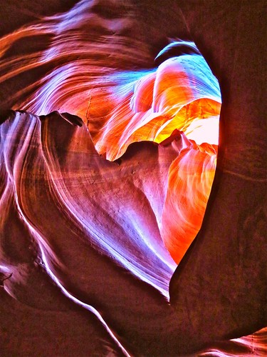 Antelope Canyon has to be one of the most amazing sights I have ever seen.
It is an underground Slot Canyon and stepping inside is like both entering a Cathedral; in that you find yourself in a majestic chamber adorned with delicate glowing colours, and a pinball machine....in that you can just imagine that at any second some mighty and unavoidable boulder will come thundering down the narrow passageway.
Depending on time of day these superb shafts of light flood through the Canyon walls making a really colourful spectacle.
I spotted this rock formation whilst we walked through, you have to be really fast with your eye as there are many people crowding through at the same time and the visit only lasts about 20 minutes but it is spectacular.