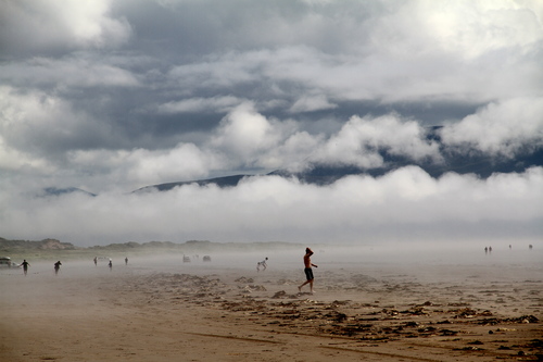 A low mist obscures the mountains and most of the sky creating an eery outer space feeling.