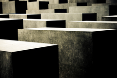 The slabs of the memorial are designed to produce an uneasy, confusing atmosphere and the whole sculpture aims to represent a supposedly ordered system that has lost touch with human reason.