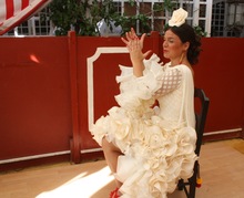 Senora keeps time in her beautiful traditional dress of the region.