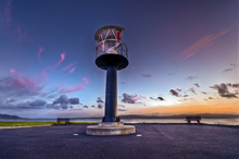 A HDR image of Buncrana lighthouse just after the sunset to the right of the lighthouse you can see the moon..